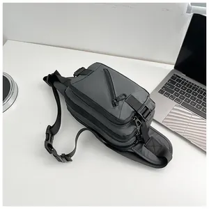 Detail view of water-resistant oxford fabric chest bag with adjustable strap and buckles