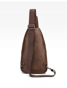 Rear view of men's vintage brown chest bag showing adjustable strap and D-ring hooks