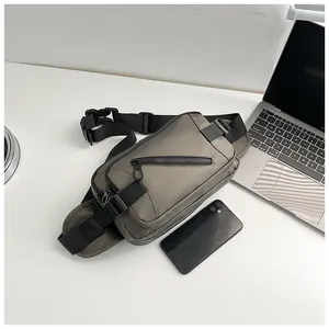 Top view of high-density nylon chest bag with adjustable strap on a modern desk