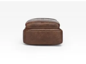Detailed macro view of the dark brown leather bag bottom with double stitching