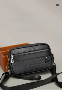 Detail of dark grey crossbody bag with S-letter pattern and silver metal zipper