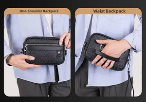Detailed view of men's gray crossbody bag showing handheld and wristlet carry modes