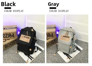 Detail view of the canvas backpack showing black and grey color options side by side