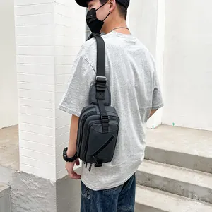 Men's casual black Oxford cloth crossbody sling bag in urban street fashion style