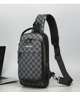 Detail view of water-resistant men's sling bag with checkered pattern and USB charging port