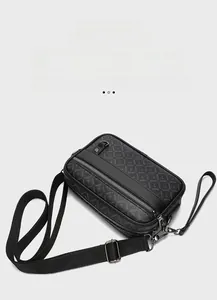 Close-up of black multifunctional crossbody bag with Y-shaped pattern and silver hardware