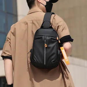Waterproof black nylon chest bag for men with orange decorative strap and durable zipper