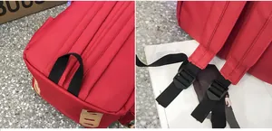 Detailed view of reinforced black webbing handle and adjustable straps on a red canvas backpack