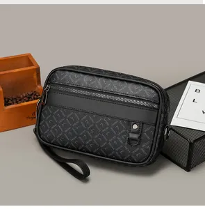 Detail of men's leather clutch bag with monogram texture and premium metal zipper