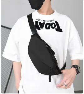 Close-up of a black sporty crossbody bag with woven rope zippers on a male model