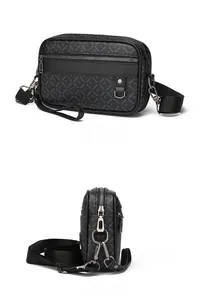 Detail view of the black printed leather crossbody bag with adjustable wide shoulder strap