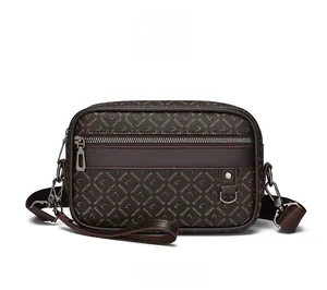 Front view of brown crossbody bag with SADINI monogram print and silver hardware