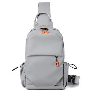 Men's Oxford chest bag in dark grey with orange zipper pulls and adjustable strap