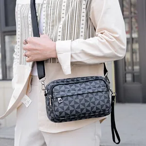 Sacoche pour homme grise avec motifs géométriques et bandoulière réglable