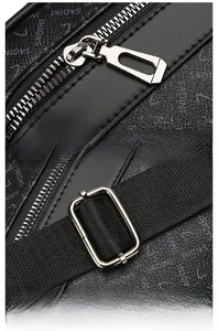 Detail of premium silver hardware zipper and adjustable textile strap on black shoulder bag