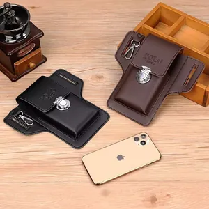 Close-up of black and brown leather phone belt pouches with metallic spring buckles