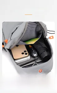 Interior view showing large capacity oxford chest bag with blue striped lining and accessories