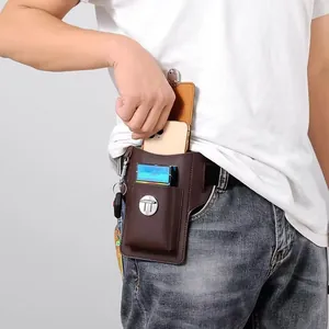 Detail of a brown leather waist pouch with a phone compartment and key ring loop