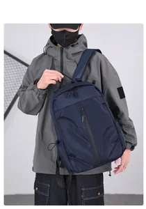 Outdoor travel backpack in navy blue shown on a model for casual business style