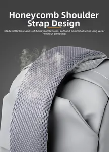 Detail of breathable honeycomb mesh shoulder strap on this grey crossbody bag