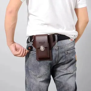 Close-up of brown leather belt phone holster featuring a metal buckle and key ring holder