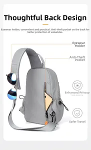 Detail of gray crossbody bag featuring a shoulder strap sunglasses hook and anti-theft pocket