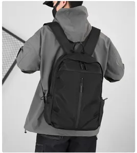 Men's matte nylon backpack featuring a sleek vertical zipper on the back profile