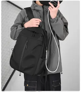 Detail view of modern black business backpack with an external USB charging port interface