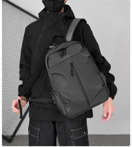 Close-up of a dark grey waterproof nylon backpack with padded ergonomic shoulder straps