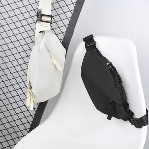 Men's sports chest bag in black and white nylon with woven rope zipper detail