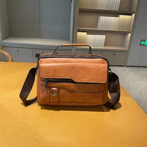 Vintage brown PU leather men's briefcase with textured finish and adjustable strap