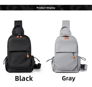 Detailed view of black and gray water-resistant chest bags with orange zipper pulls
