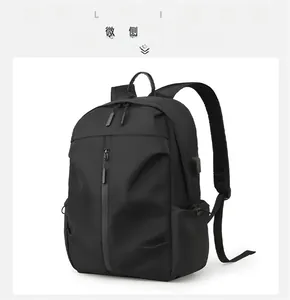 Detail view of black travel backpack with integrated USB charging port and side pocket