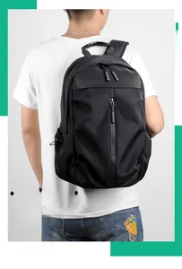 Detail view of a black waterproof nylon casual backpack with trendy vertical front zipper