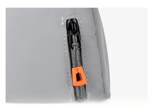 Detailed macro view of the smooth gray fabric zipper with bright orange puller tabs