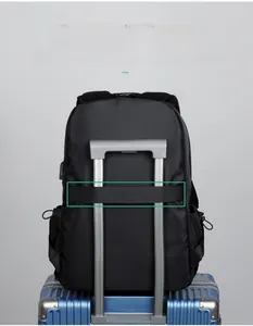 Detail of travel backpack with luggage strap and integrated USB charging port