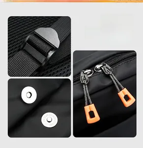 Détails du tissu noir avec boucle magnétique argentée et tirettes de fermeture orange