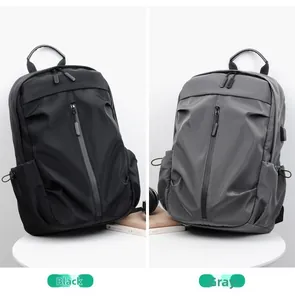 Detail view of the sleek laptop backpack featuring a USB charging port in black and grey