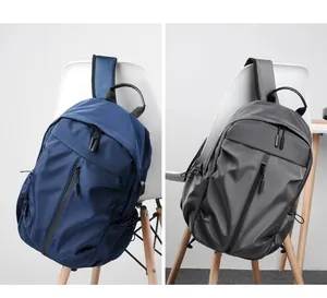 Detailed comparison of gray and navy waterproof nylon backpacks with side USB port