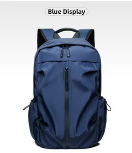 Detail of dark blue waterproof nylon backpack featuring vertical zip and drawstring side pocket