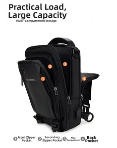 Detail view of the multi-compartment storage system and USB port on black oxford chest bag
