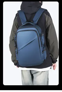 Rear view of a navy blue business backpack with waterproof fabric on a male model