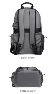 Detail view showing thick S-shaped shoulder straps and luggage strap on grey backpack