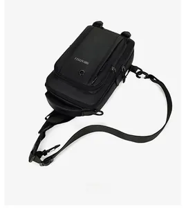 Detail view of water-resistant black oxford fabric and adjustable shoulder strap on chest bag