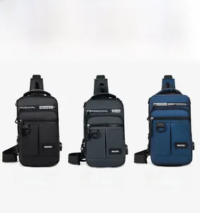Detail view of men's oxford chest bags in black, grey, and blue with USB port