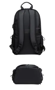 Detail view of the ergonomic breathable shoulder straps and luggage strap on black backpack