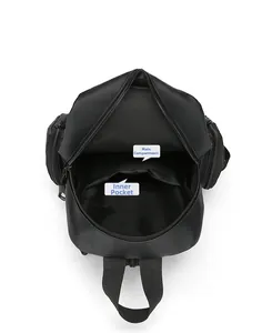 Internal view showing the main compartment and inner patch pocket of this black chest bag