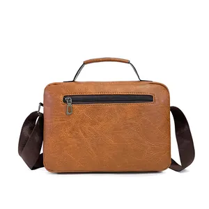 Detailed back view of brown leather business bag showing texture and zipper pocket