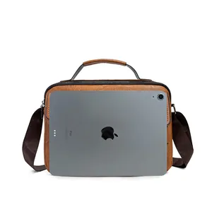 Brown leather briefcase with pebble grain texture and top handle for business use