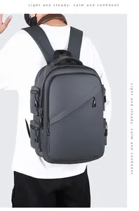 Detail view of the ergonomic padded straps and back panel of this dark grey business backpack